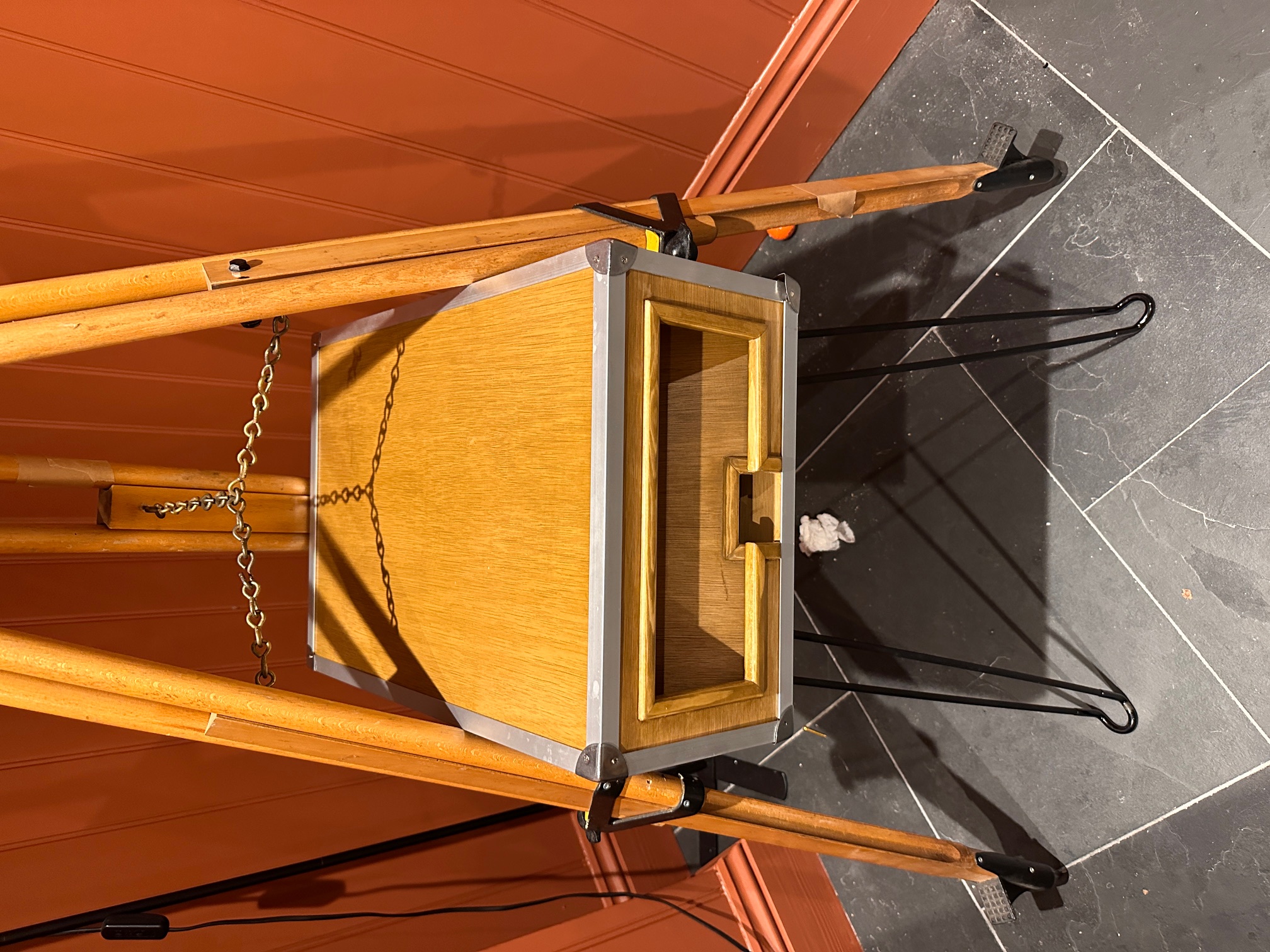 Close-up of the handcrafted oak pod frame and printer